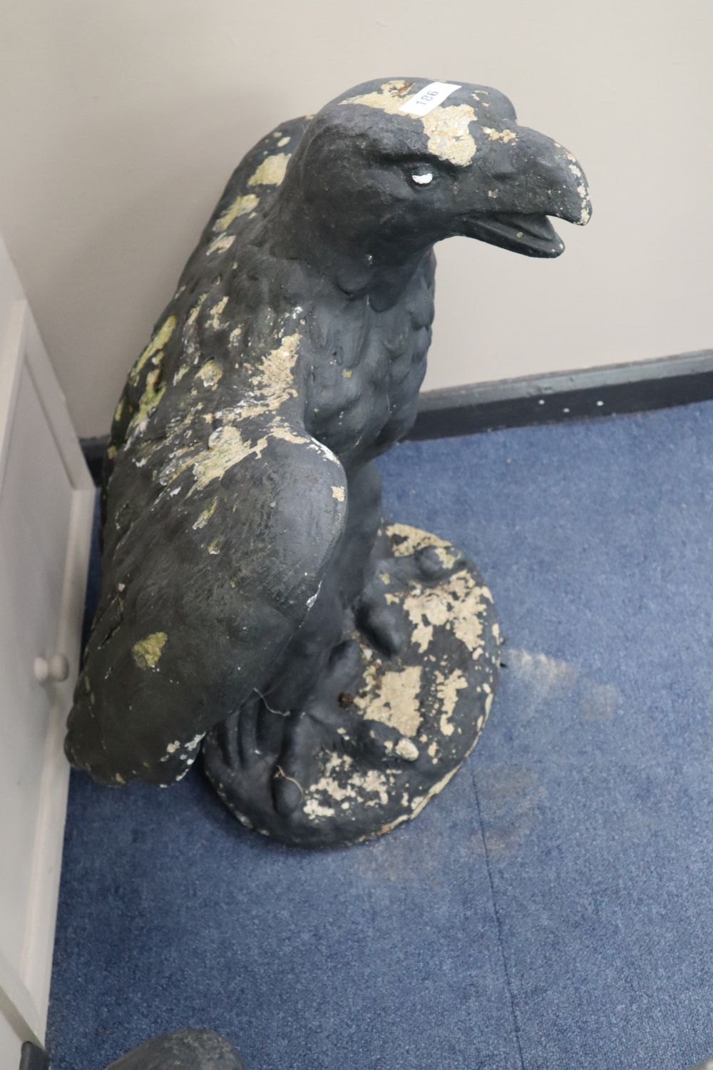 A pair of reconstituted stone eagle garden ornaments, height 78cm